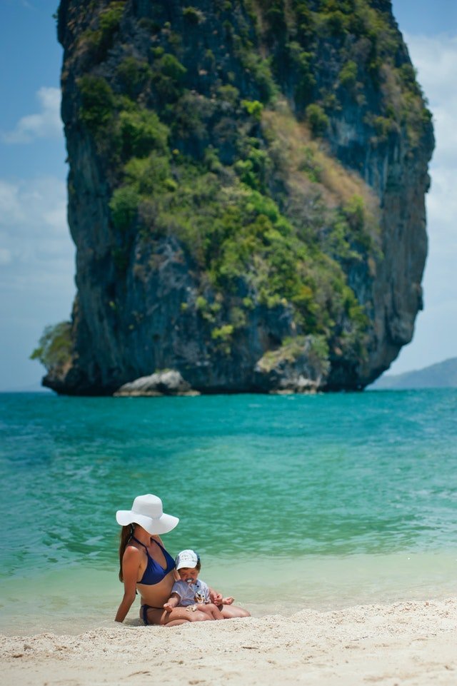A mother and child on a tropical beach
